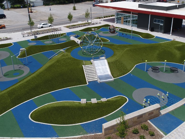 Tarkington Park in Indianapolis, IN, featuring Playground Grass® Ultra by ForeverLawn