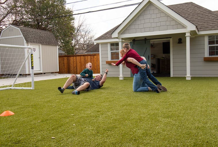 Copp Family from Fixer Upper playing on Playground Grass