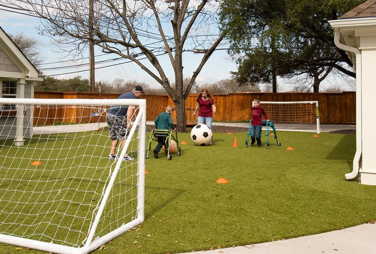 Copp Family from Fixer Upper playing on Playground Grass