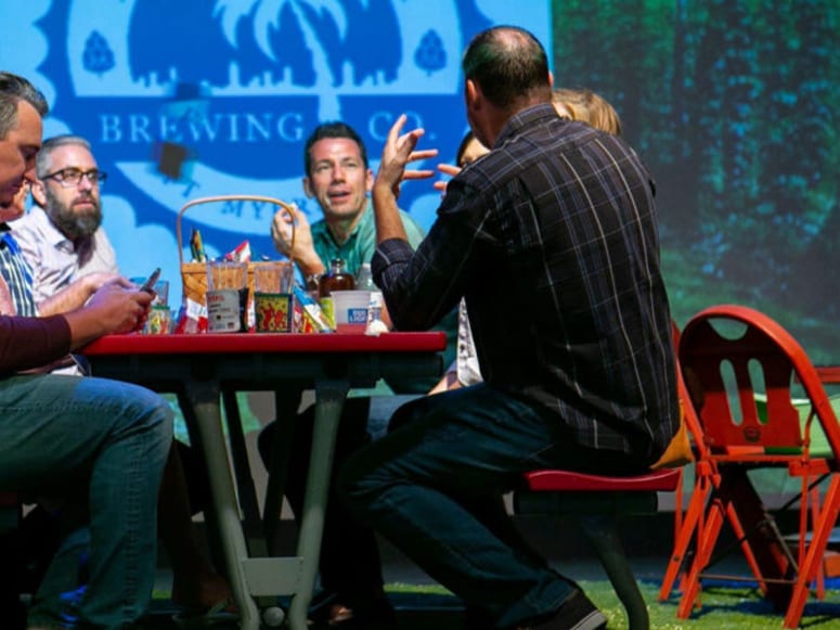 Staged picnic centerpiece featuring Playground Grass® Ultra at the Arts on Tap fundraiser event