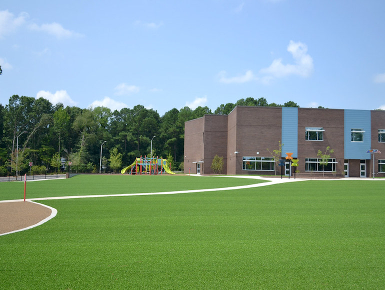 Stough Elementary Playground featuring Playground Grass synthetic turf by ForeverLawn